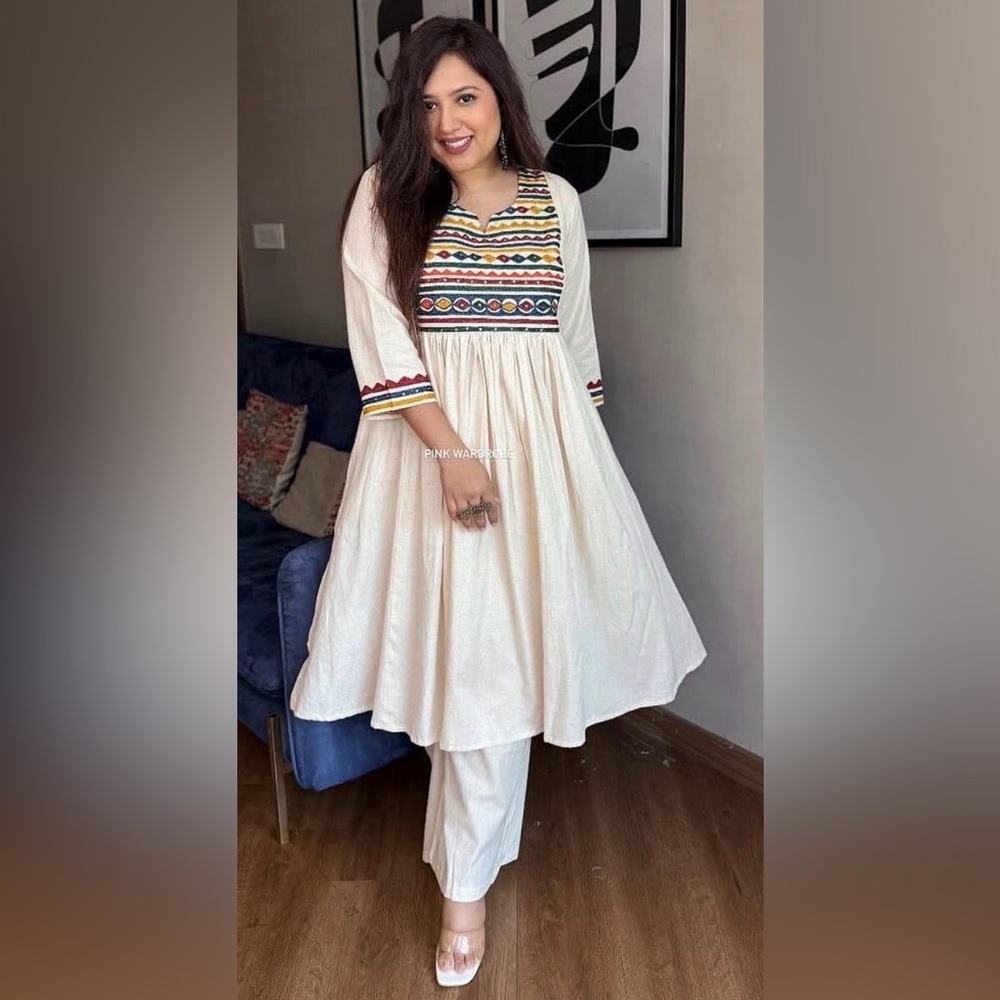 Embroidered Ivory A-Line Indian outfit with Multicolor Yoke. Flex cotton